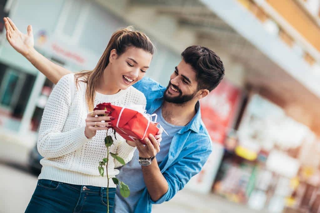 15 Clear Signs You're Not Ready for a Relationship 17 romantic man giving flower gift box woman valentines day