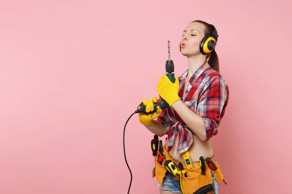 The Truth Behind Walkaway Wives: Debunking 7 Absurd Myths 11 stock photo energy sexy handyman woman gloves noise insulated headphones kit tools