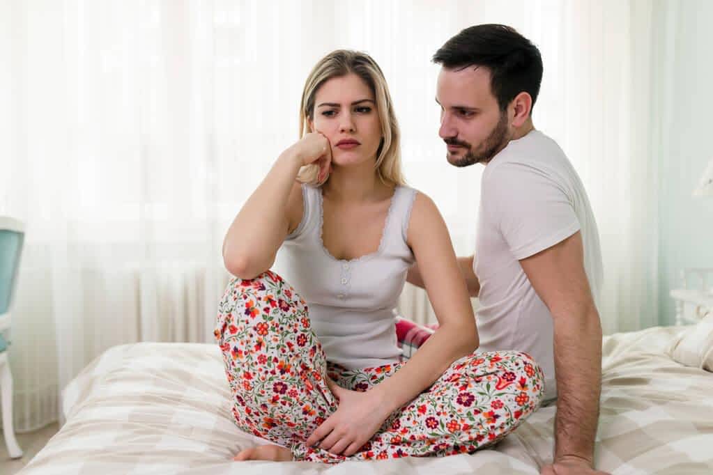 young couple having arguments sexual problems bed
