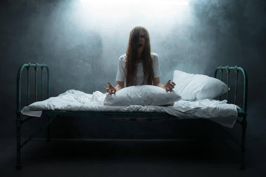 psycho woman screams bed insomnia horror dark smoky room background