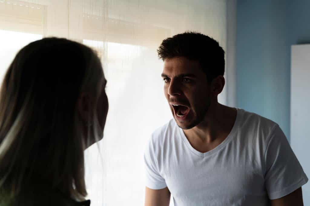 Why Smart Men Stay Trapped in Marriages That Drain Them 2 man and woman in a screaming argument