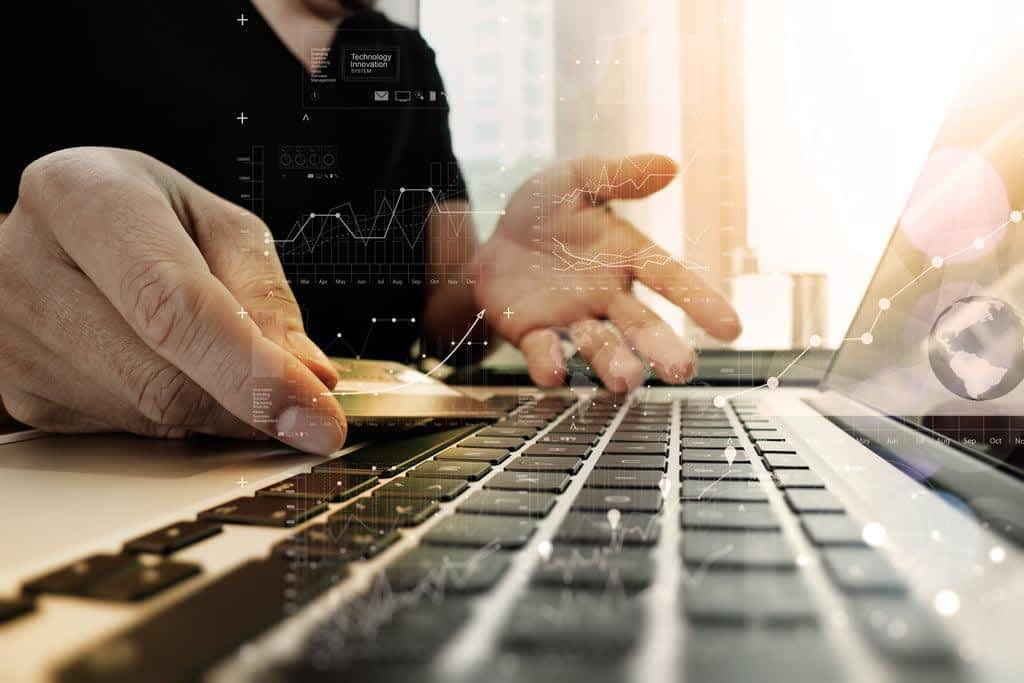 hands using laptop and holding credit card with digital layer effect diagram as Online shopping concept