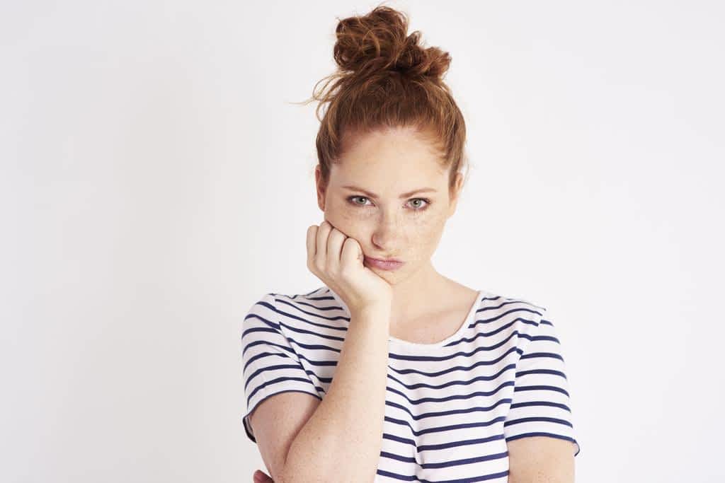 portrait bored resentful woman studio shot