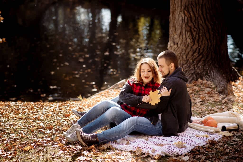 14 Unique Cozy Fall Date Ideas (Not at a Pumpkin Patch) 6 couple man woman sit blanket
