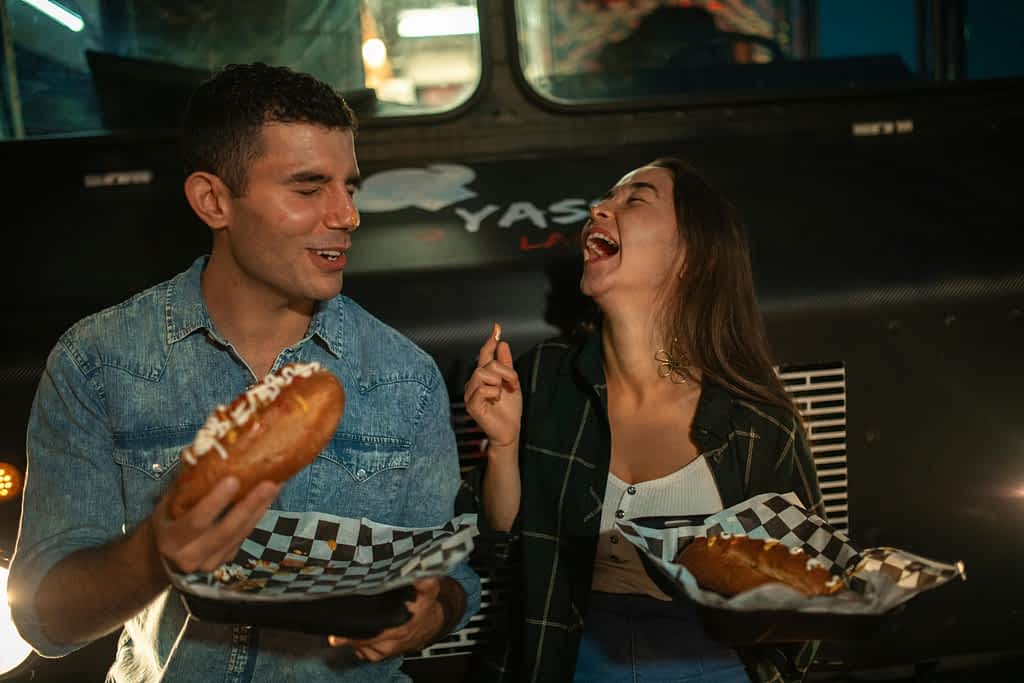 Man and woman laughing together at a restaurant