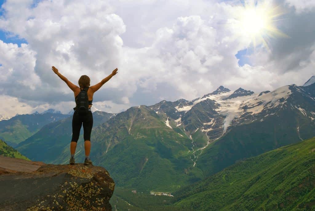 young beautiful girl in mountains