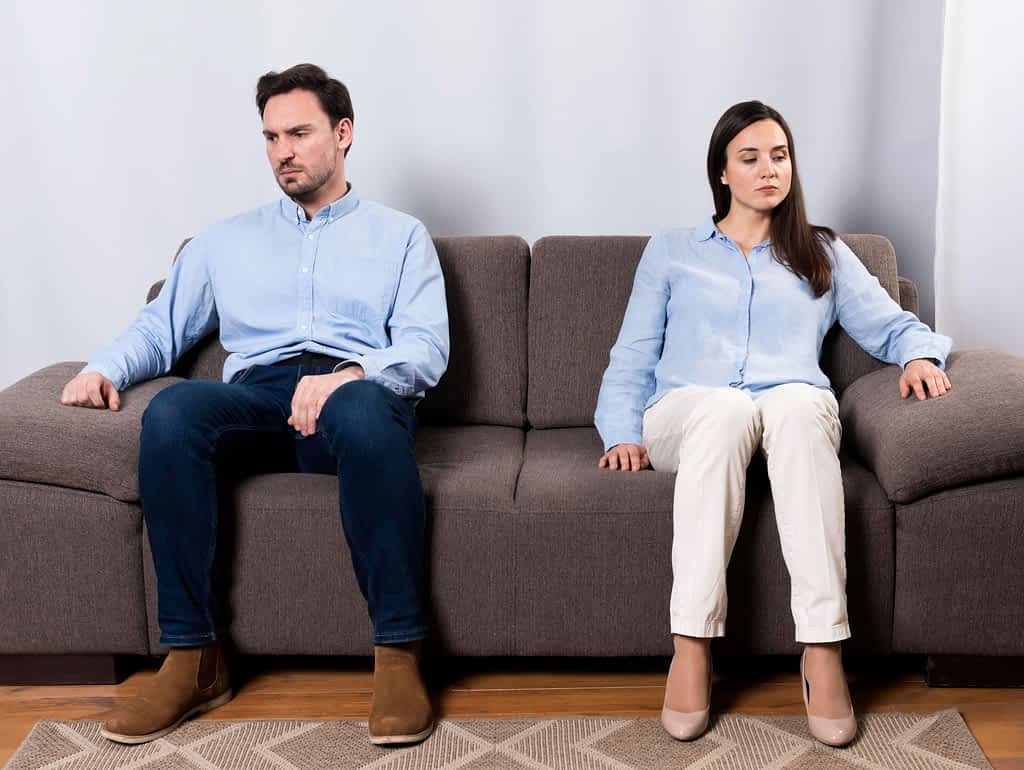 The Surprising Way You'll Know Divorce Was Your Best Decision 2 Angry man and woman sit on couch looking away from each other