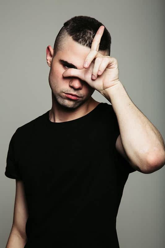 guy showing loser sign