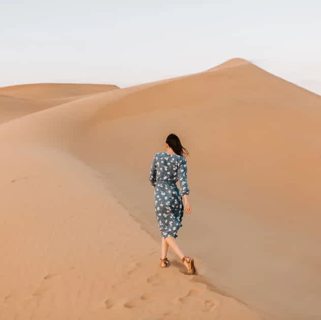 When Love Becomes a Game of Control: The Hidden Power Dynamics That Destroy Relationships 2 woman walking away up a desert sand dune