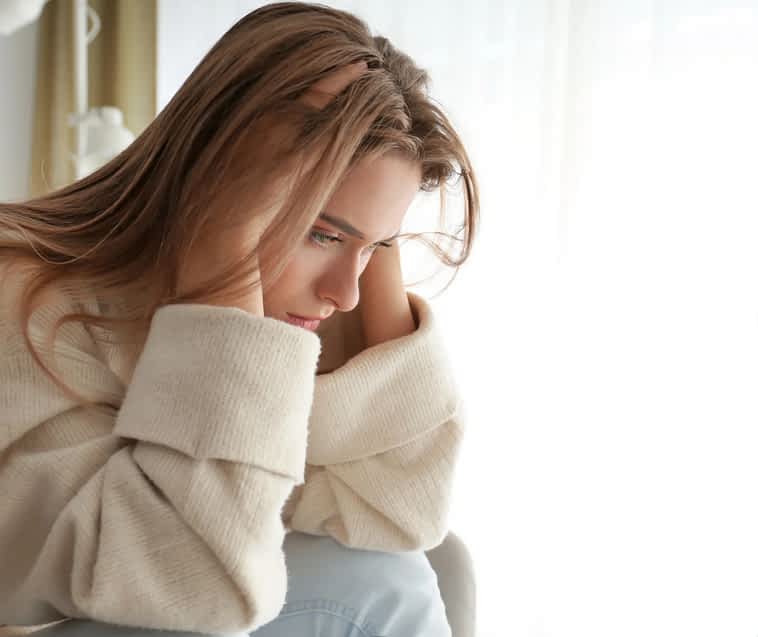 You'll Cycle Through These Emotional Healing Stages Before Feeling Whole Again 2 woman looking concerned depressed, and stressed