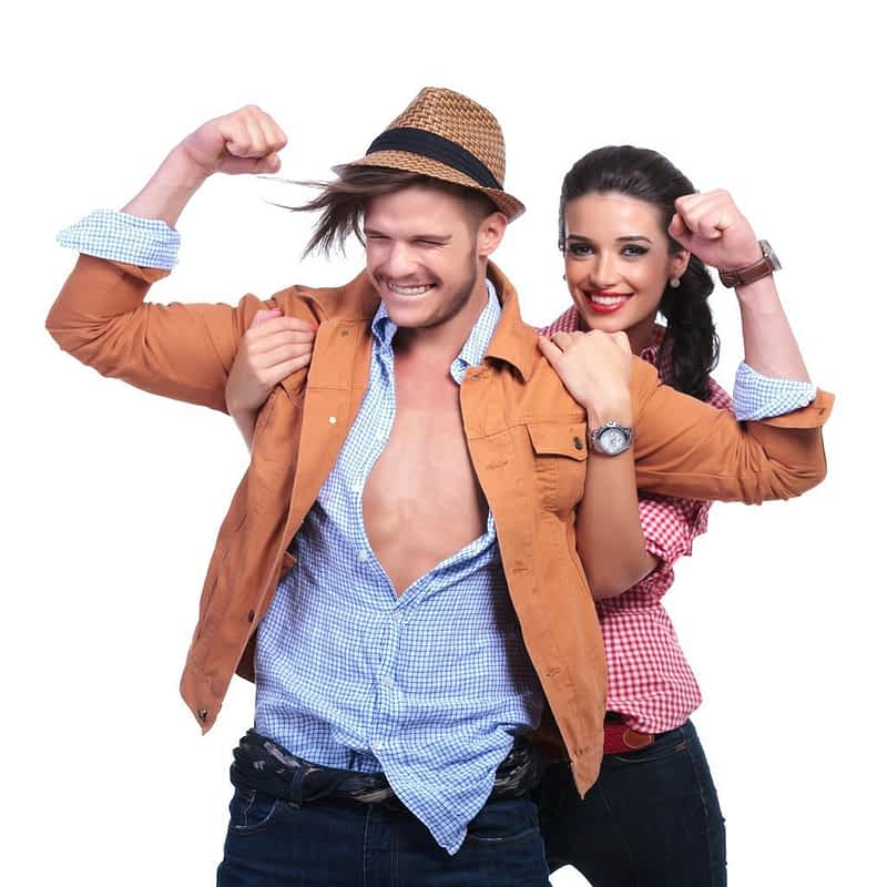 9 Fake Alpha Male Traits: Eye-Opening Ways to Spot a Phony 8 casual couple with man showing his biceps