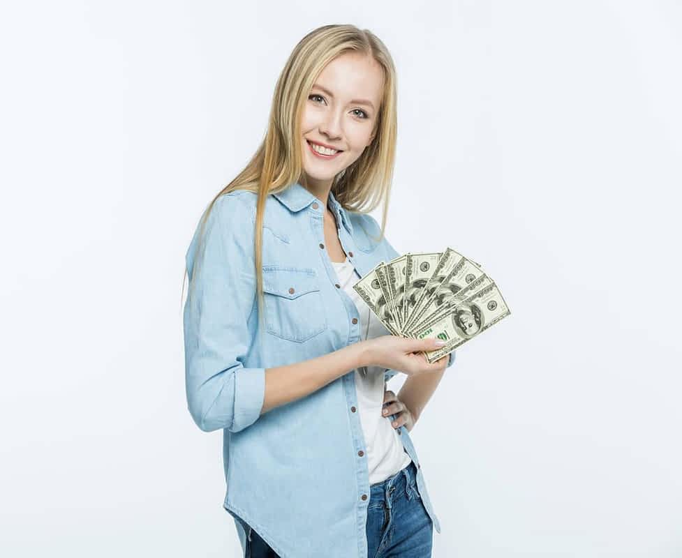 woman holding dollars
